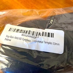 Ray-Ban reading glasses - never used; get your lenses inserted. Gun metal color